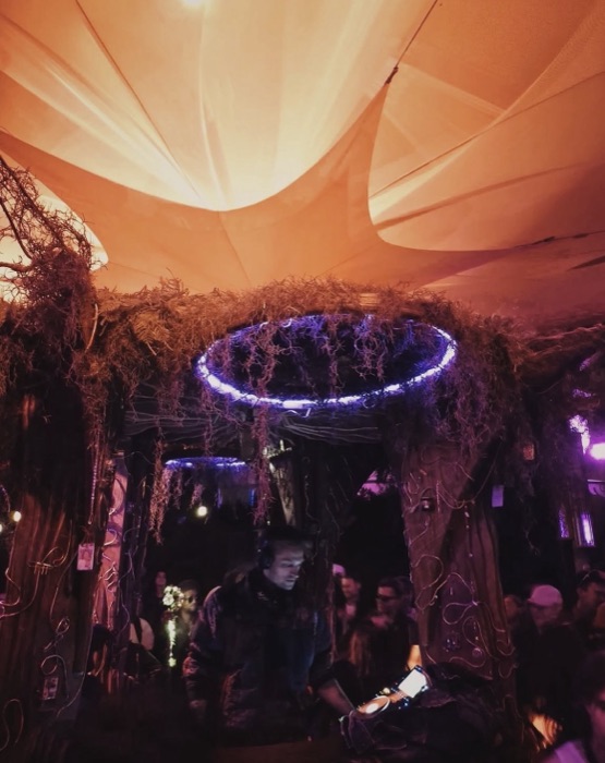 Purple-lit canopy interior beneath a mirrored disco ceiling